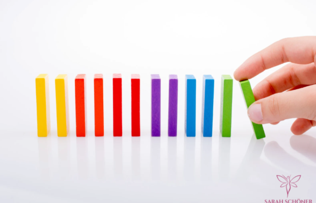 Hand moving colorful blocks to represent career change and new opportunities